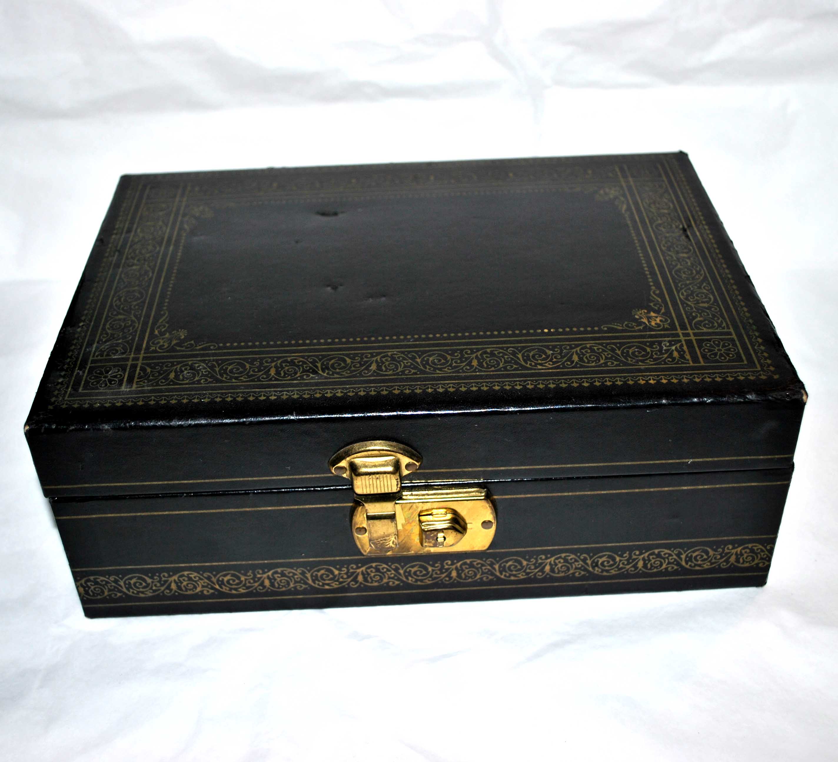 Vintage jewelry box in black leather and red interior
