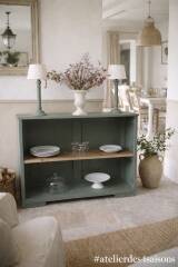 Vintage workshop furniture transformed into a re-enchanted bookshelf in smoky green.