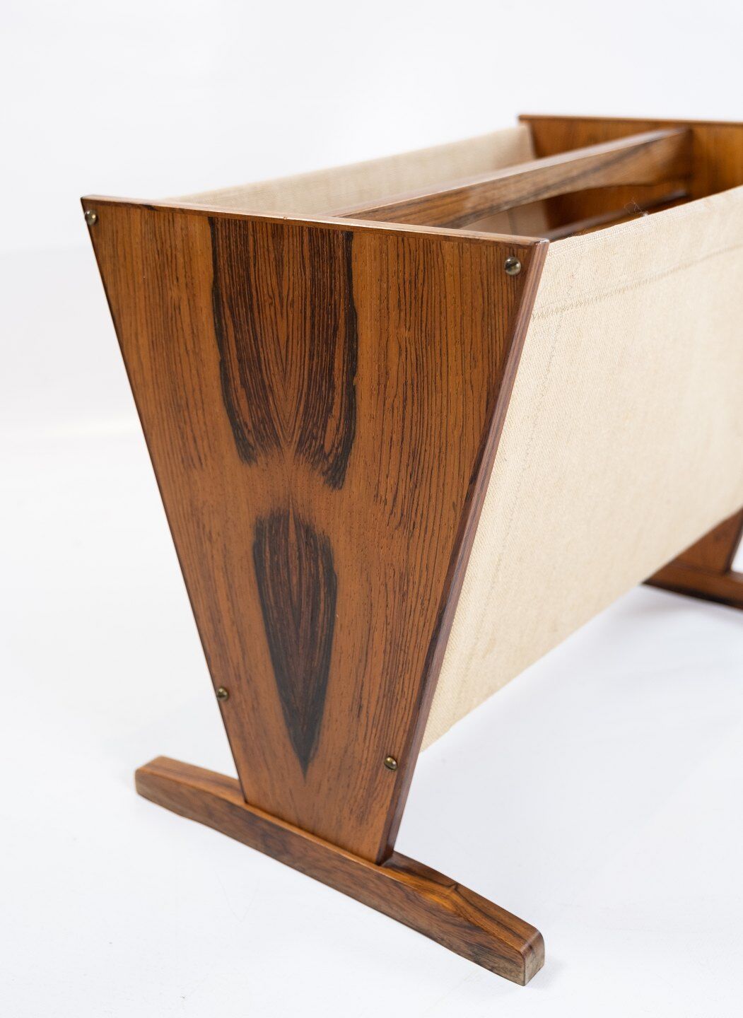 News paper rack in rosewood and canvas of danish design from the 1960s.