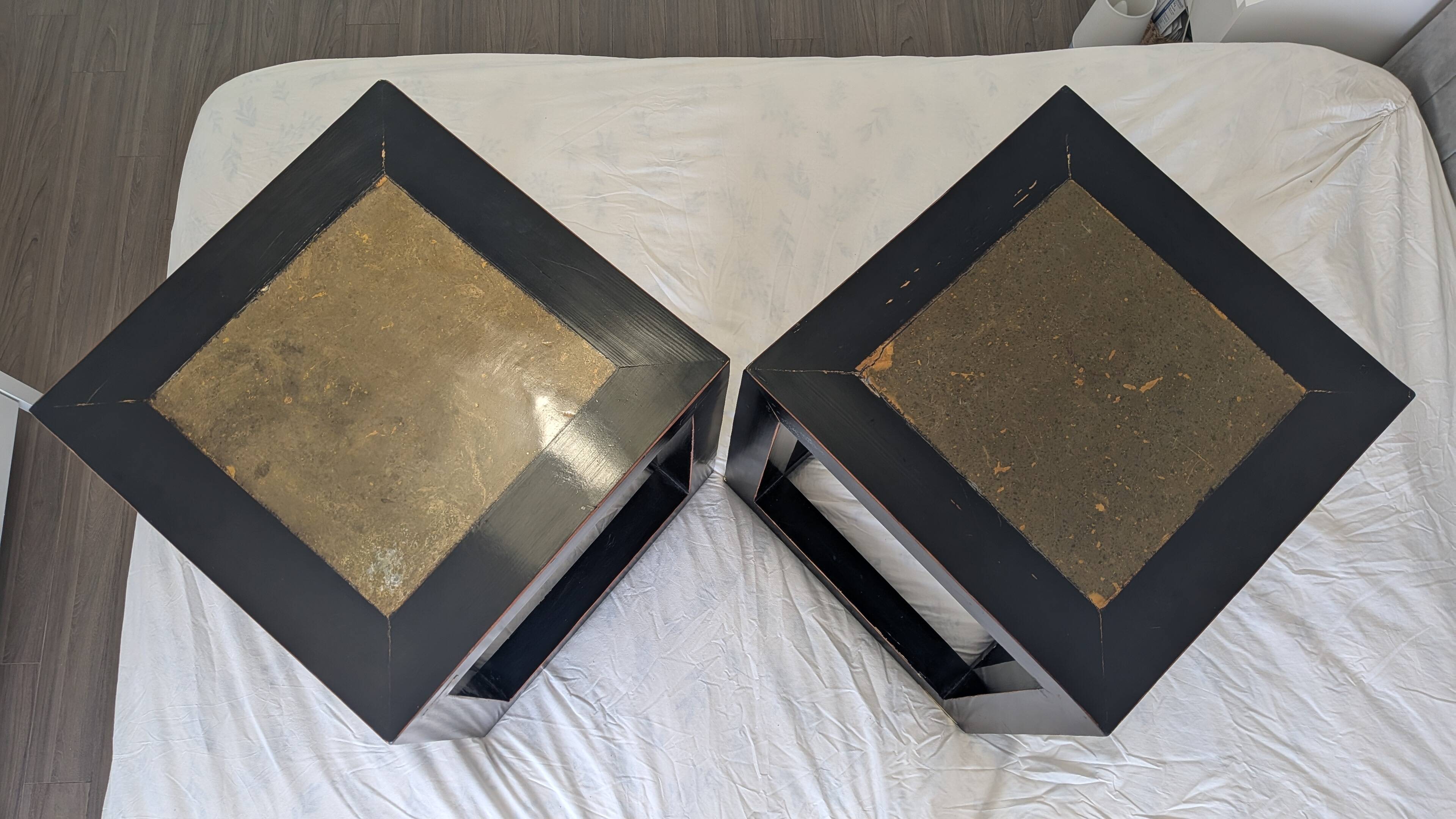 Chinese side tables in black lacquer, stone top.