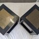 Chinese side tables in black lacquer, stone top.