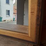 Old mirror of period handmade by cabinetmaking and decorated with gold leaf