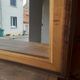 Old mirror of period handmade by cabinetmaking and decorated with gold leaf