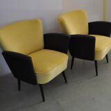 Pair of vintage 1950s cocktail chairs in yellow velvet and black faux leather, wooden frame.