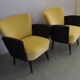 Pair of vintage 1950s cocktail chairs in yellow velvet and black faux leather, wooden frame.