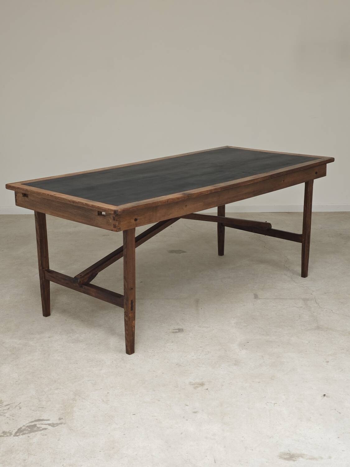Vintage workshop folding table in oak with a hand-patinated black top.