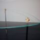 Vintage glass and black-painted brass side table
