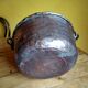 large copper and bronze cauldron