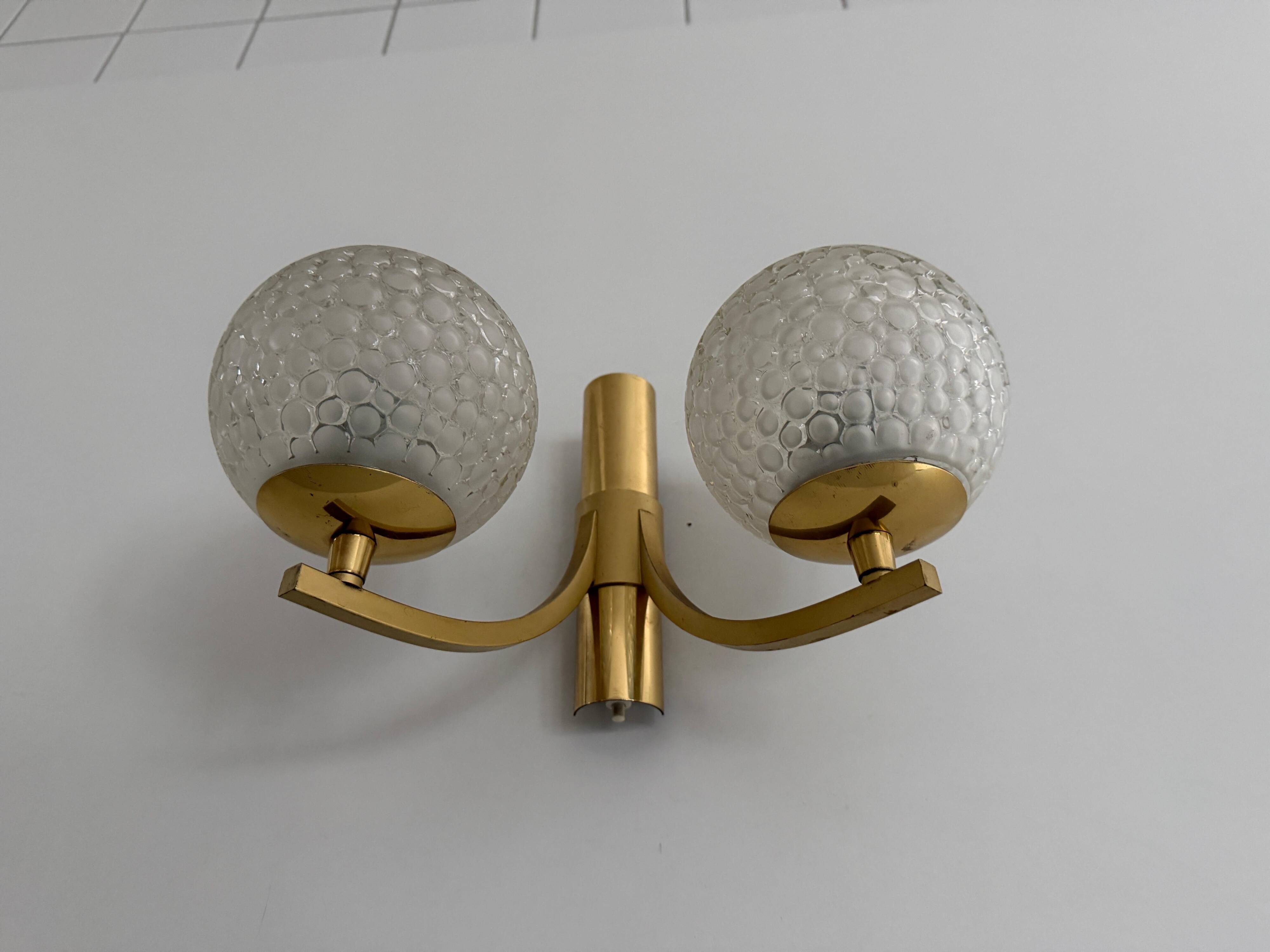 Simple two-armed wall light in brass and glass by Ball and Ball, Kaiser, 1960s, Germany.