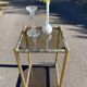 Square faux bamboo pedestal table in gold-plated brass and glass