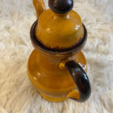 Teapot in yellow ceramic with the logo