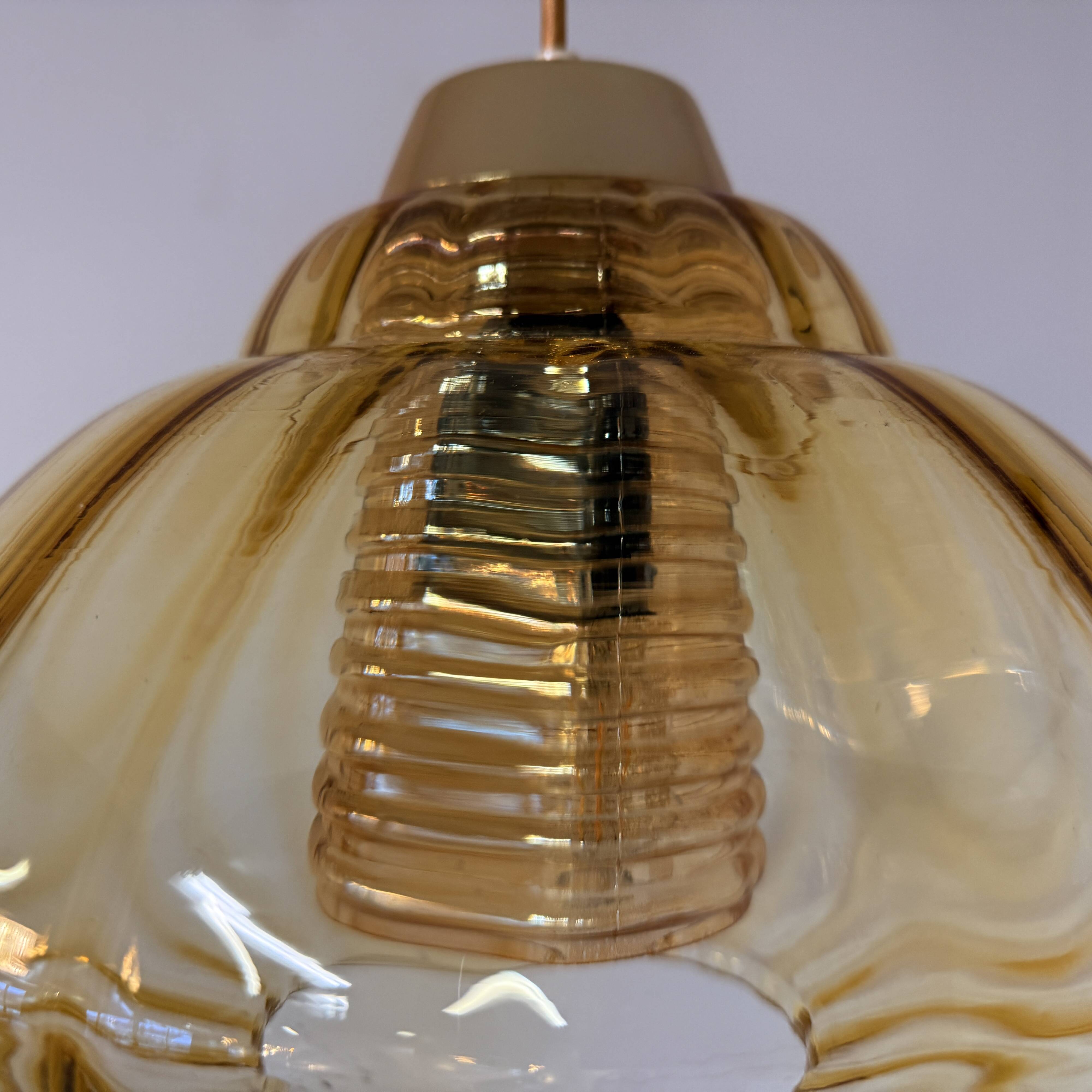 Vintage pendant lamp with amber glass shade