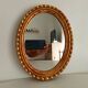 Miroir ovale italien vintage en bois doré