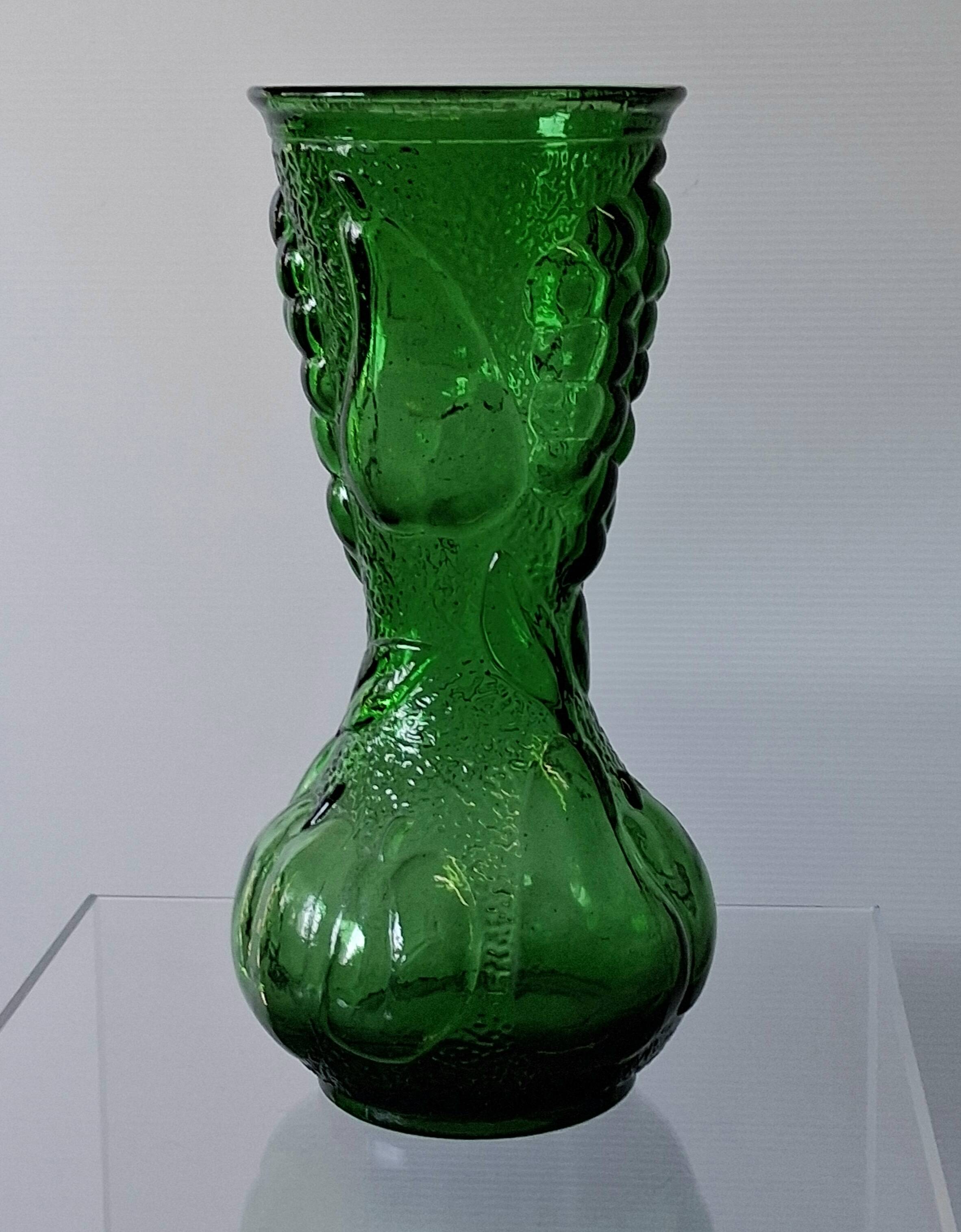 Vintage green glass vase with a fruit design in very good condition.