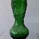 Vintage green glass vase with a fruit design in very good condition.