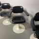 A striking set of four vintage swivel dining chairs