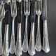 12 Forks and 12 cheese or dessert knives – Orfèvrerie Perrin Paris