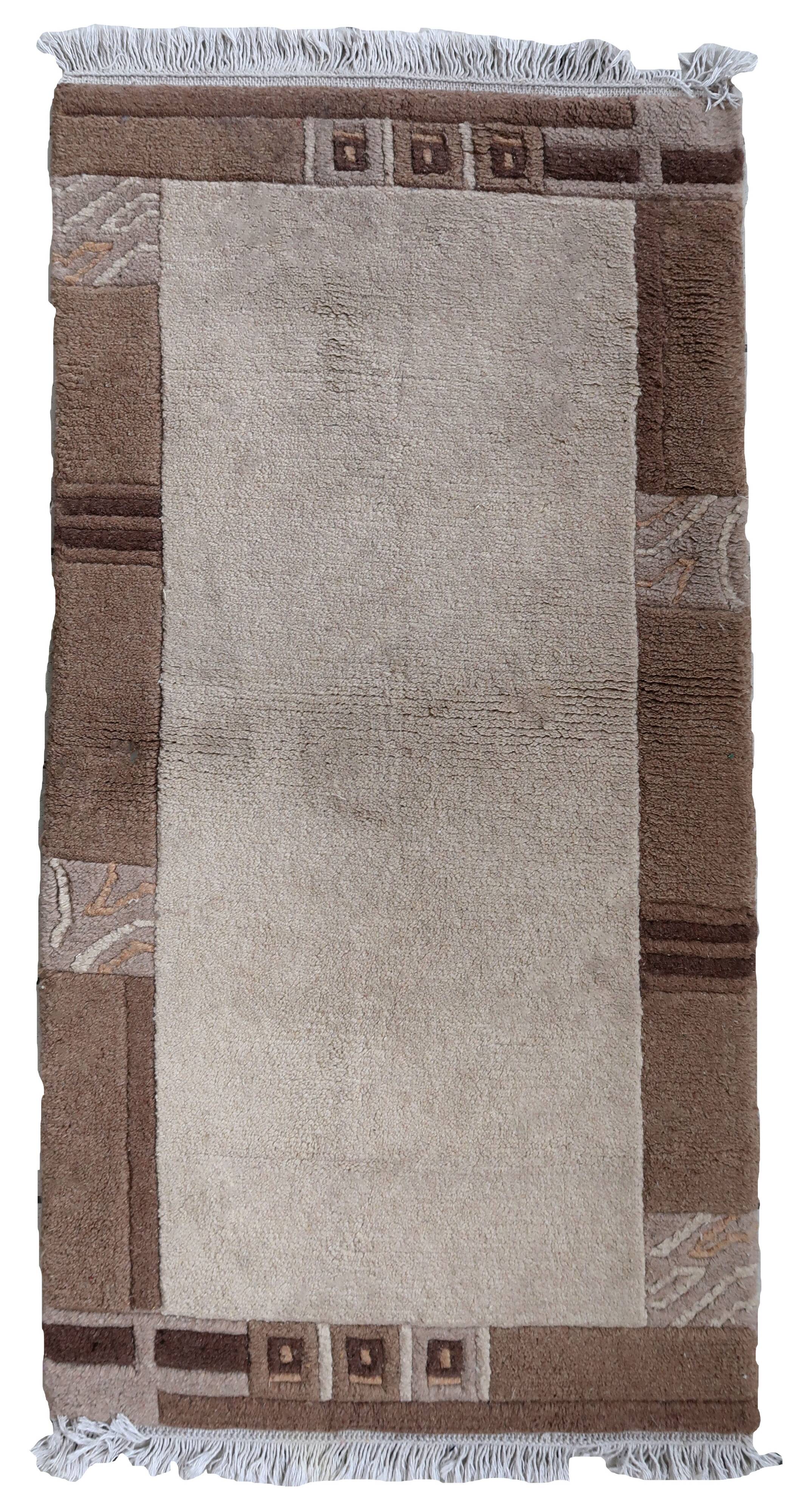 Tapis vintage tibétain Khaden fait main en laine – 64 x 124 cm  Années 1970