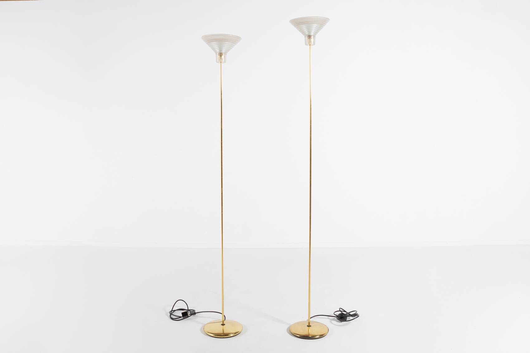 Pair of Italian golden floor lamps with glass shade, 1970’s