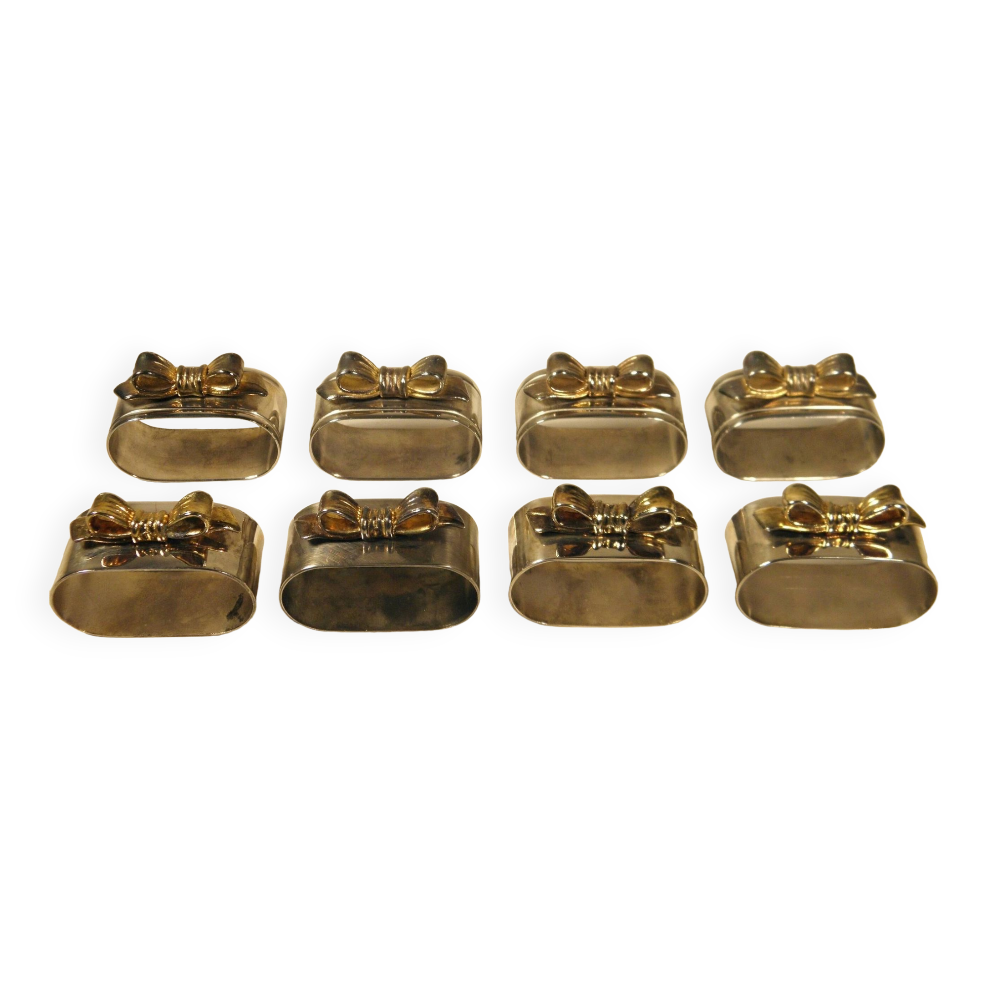 8 silver and gold napkin rings