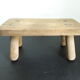 Vintage footstool in light wood