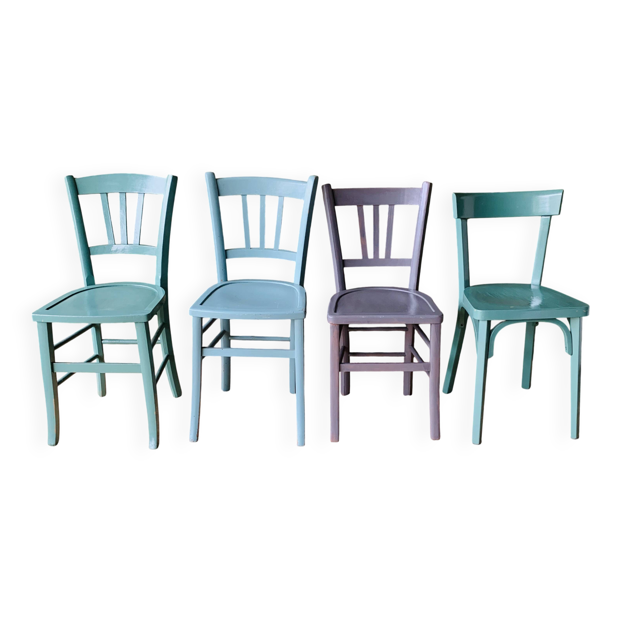 Set of four mismatched bistro chairs