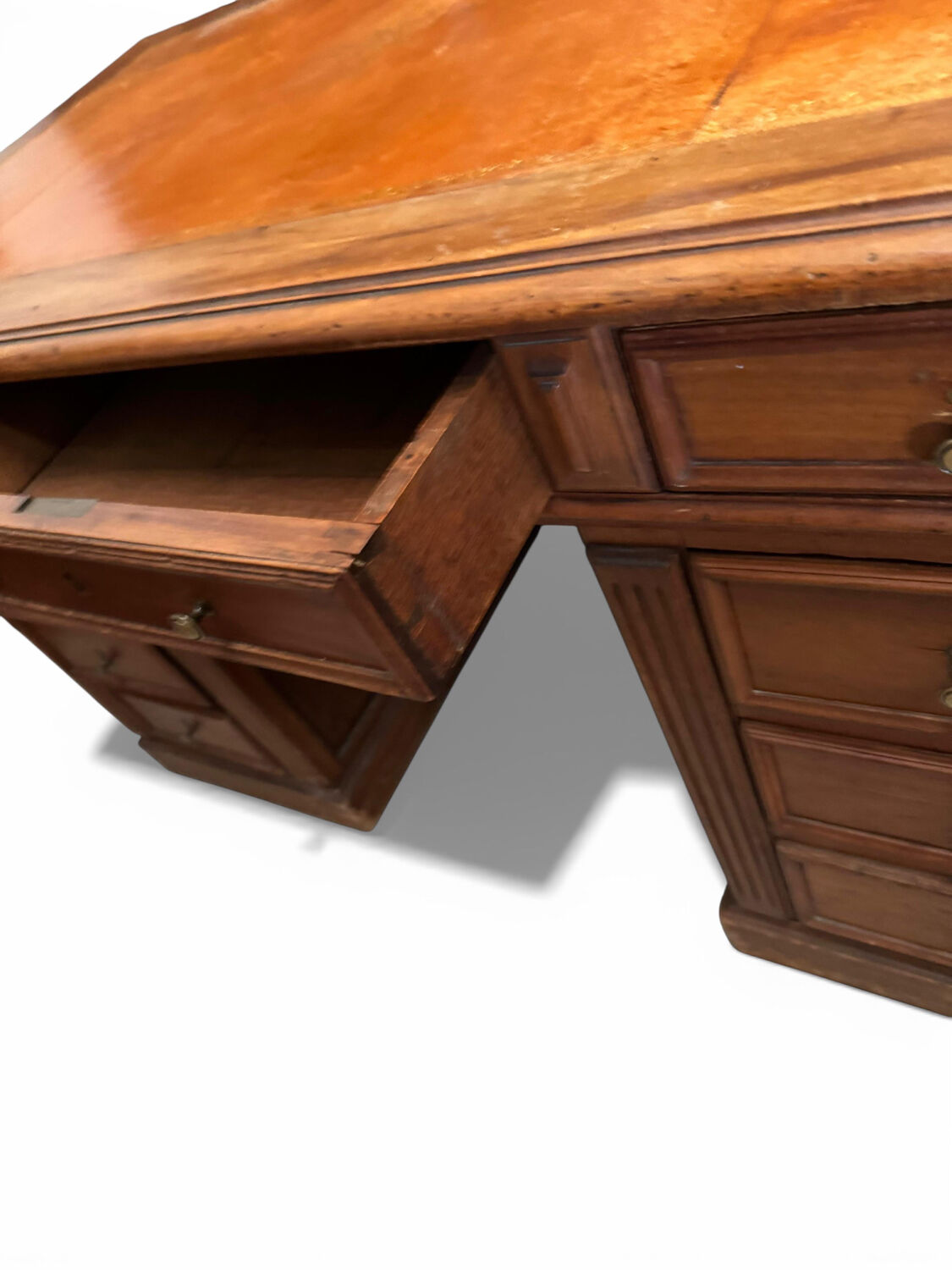 Oak desk with 9 drawers and leather writing pad.