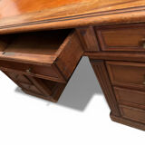 Oak desk with 9 drawers and leather writing pad.