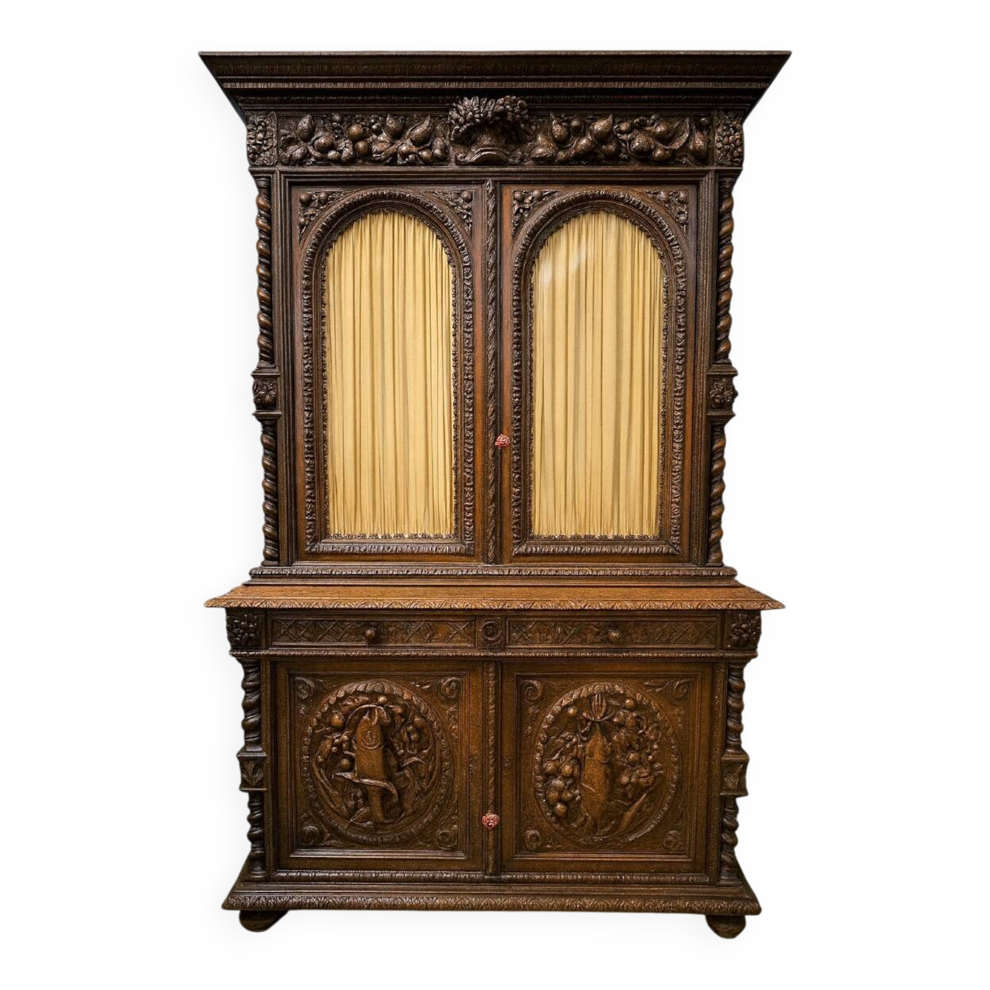 Two-body buffet in solid oak, richly carved in the Renaissance style.