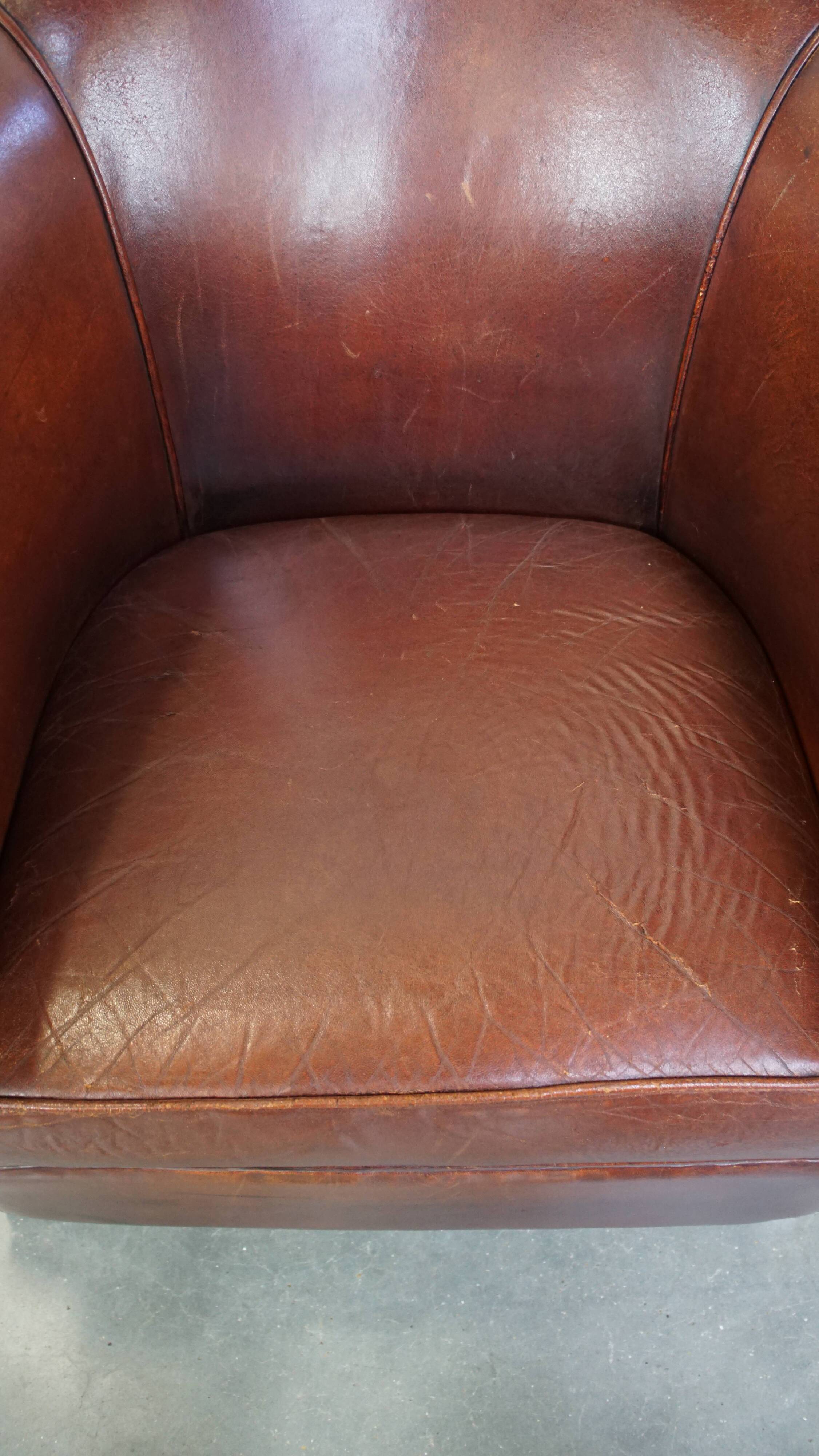 English style sheepskin club chair with a beautiful patina