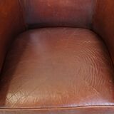 English style sheepskin club chair with a beautiful patina