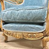 Art deco living room around 1920 in carved wood upholstered in blue velvet, a sofa two armchairs