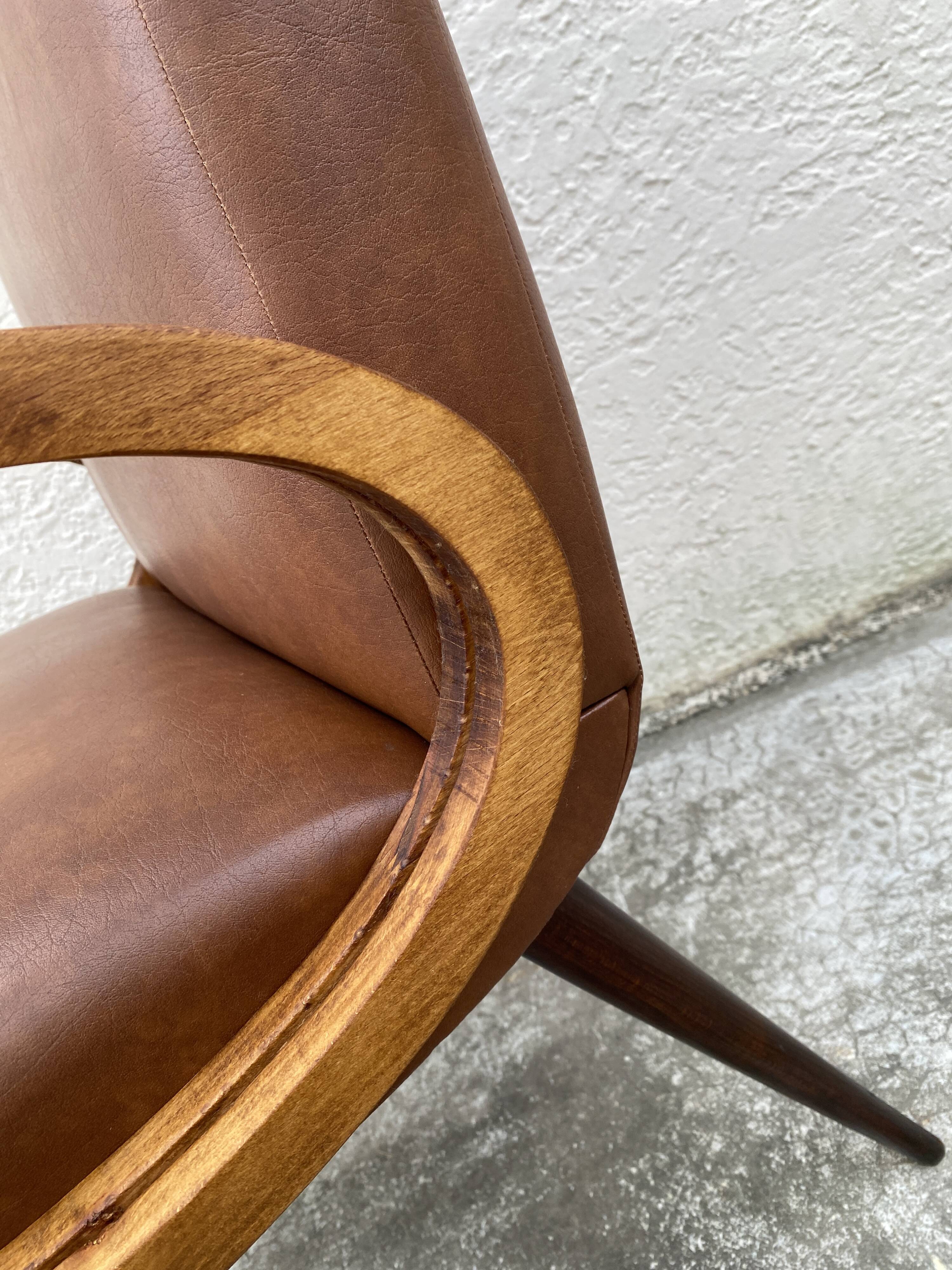 Mid-Century Scandinavian vintage retro armchair with oval armrests.