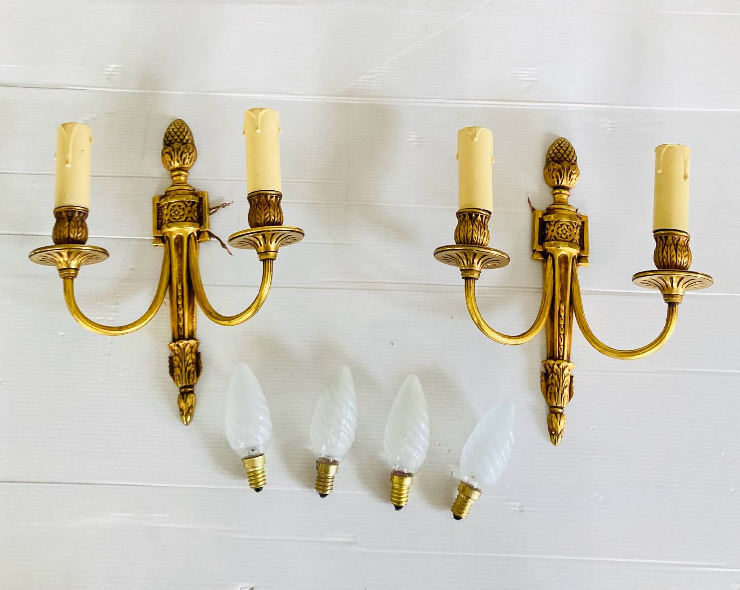 St Louis XVI gilded bronze wall lights with foliage and pine cone decorations