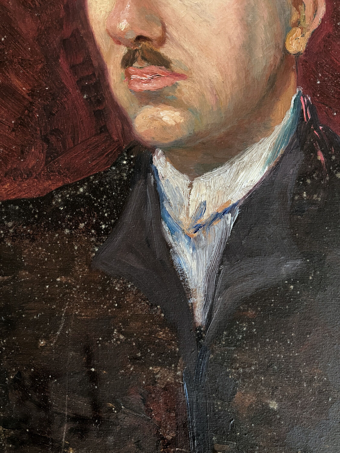 Old oil painting on cardboard portrait of a man in a dark suit