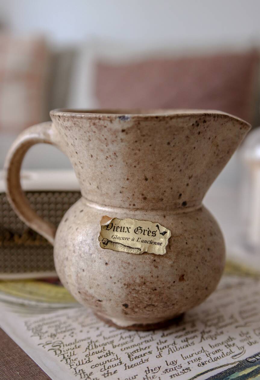 Small pitcher in old speckled stoneware