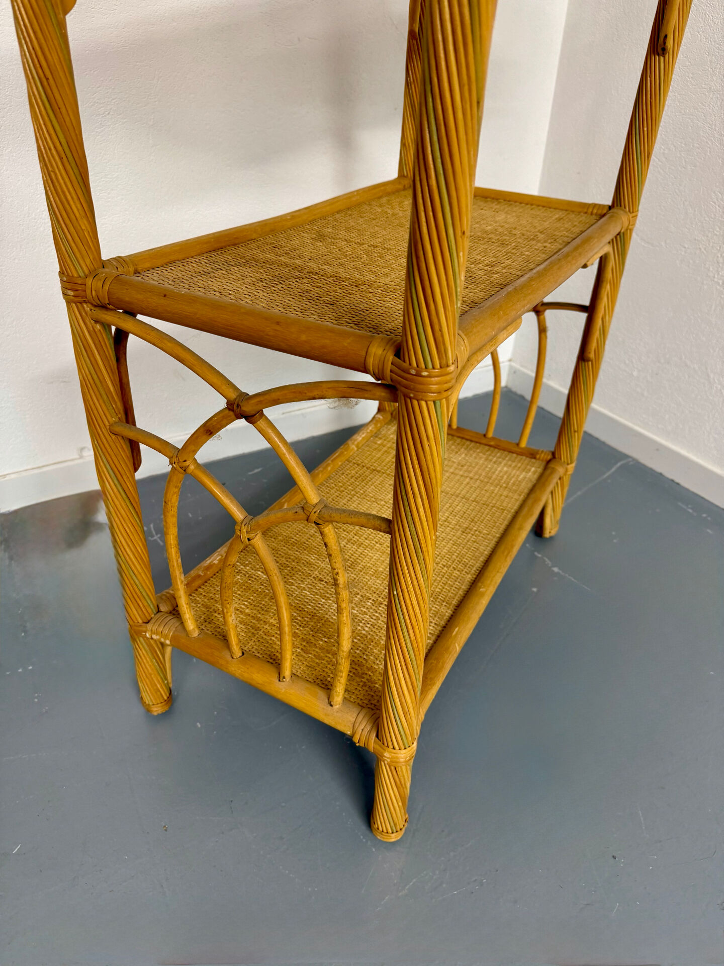 Large woven rattan bookshelf designed in the 1970s.