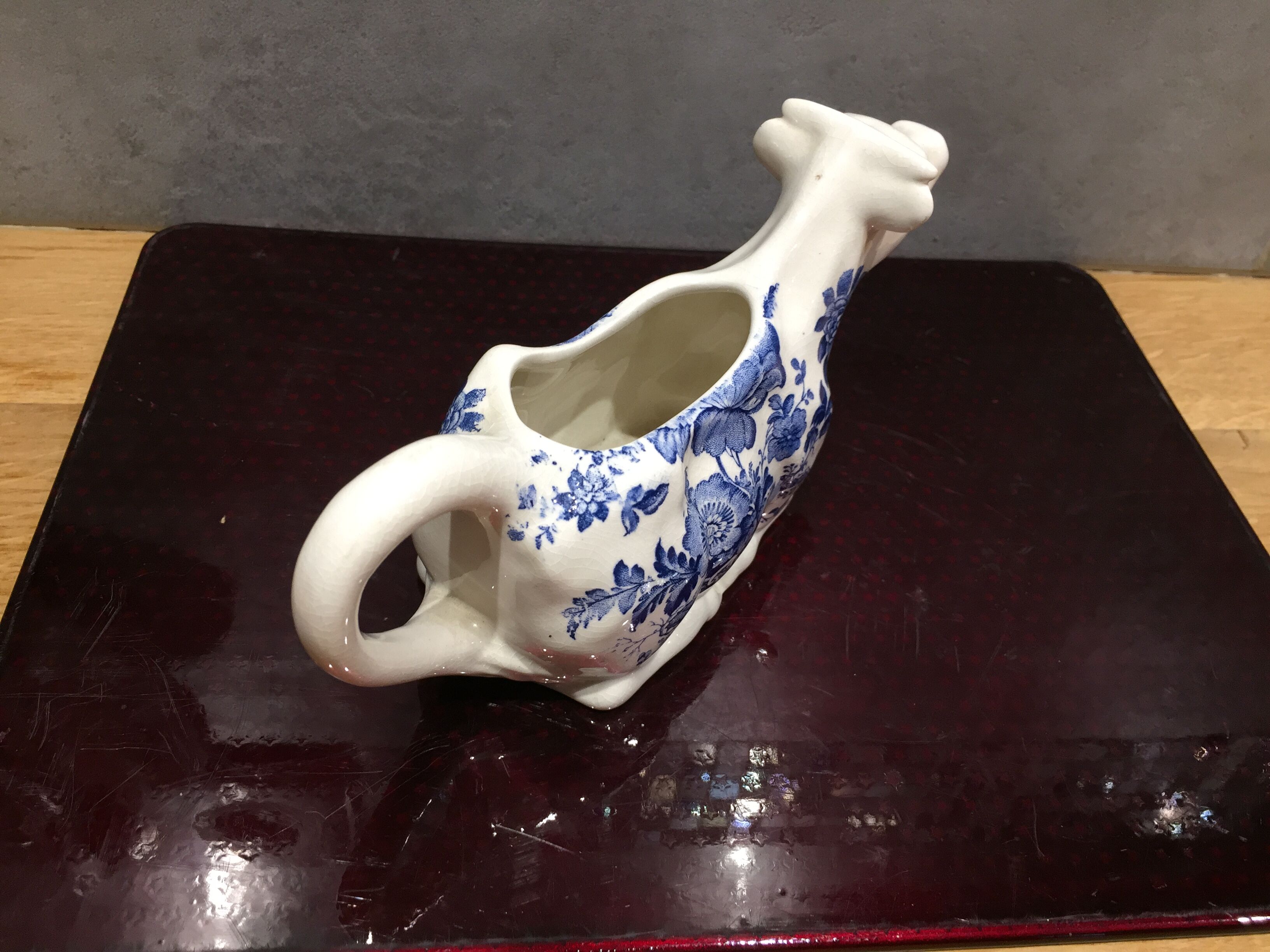 English porcelain cow-shaped sauce dish