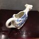 English porcelain cow-shaped sauce dish