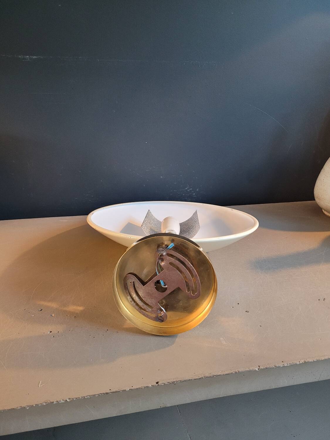 Gold and cream white saucer wall sconce