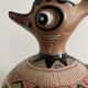 Clay pitcher with a bird head