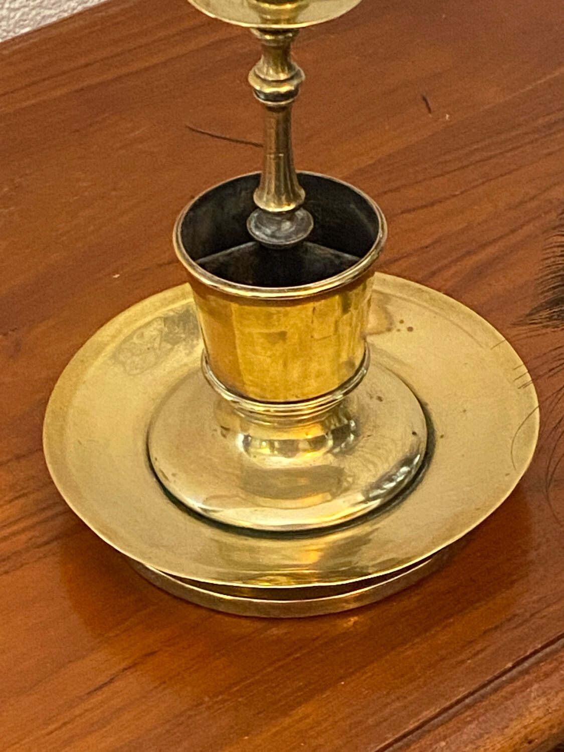 Compartmentalised brass candlestick