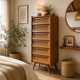 Vintage rattan chest of drawers with splayed legs from the 1950s.