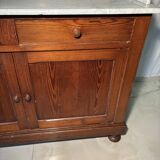 Antique wood and marble kitchen sideboard with carved backsplash