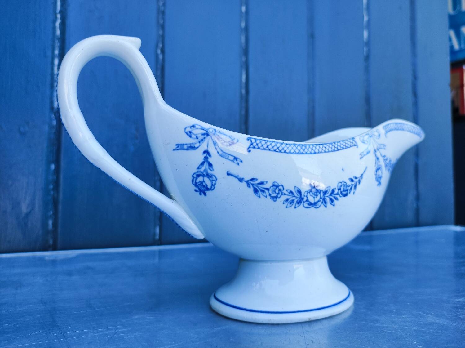 Old earthenware sauce boat