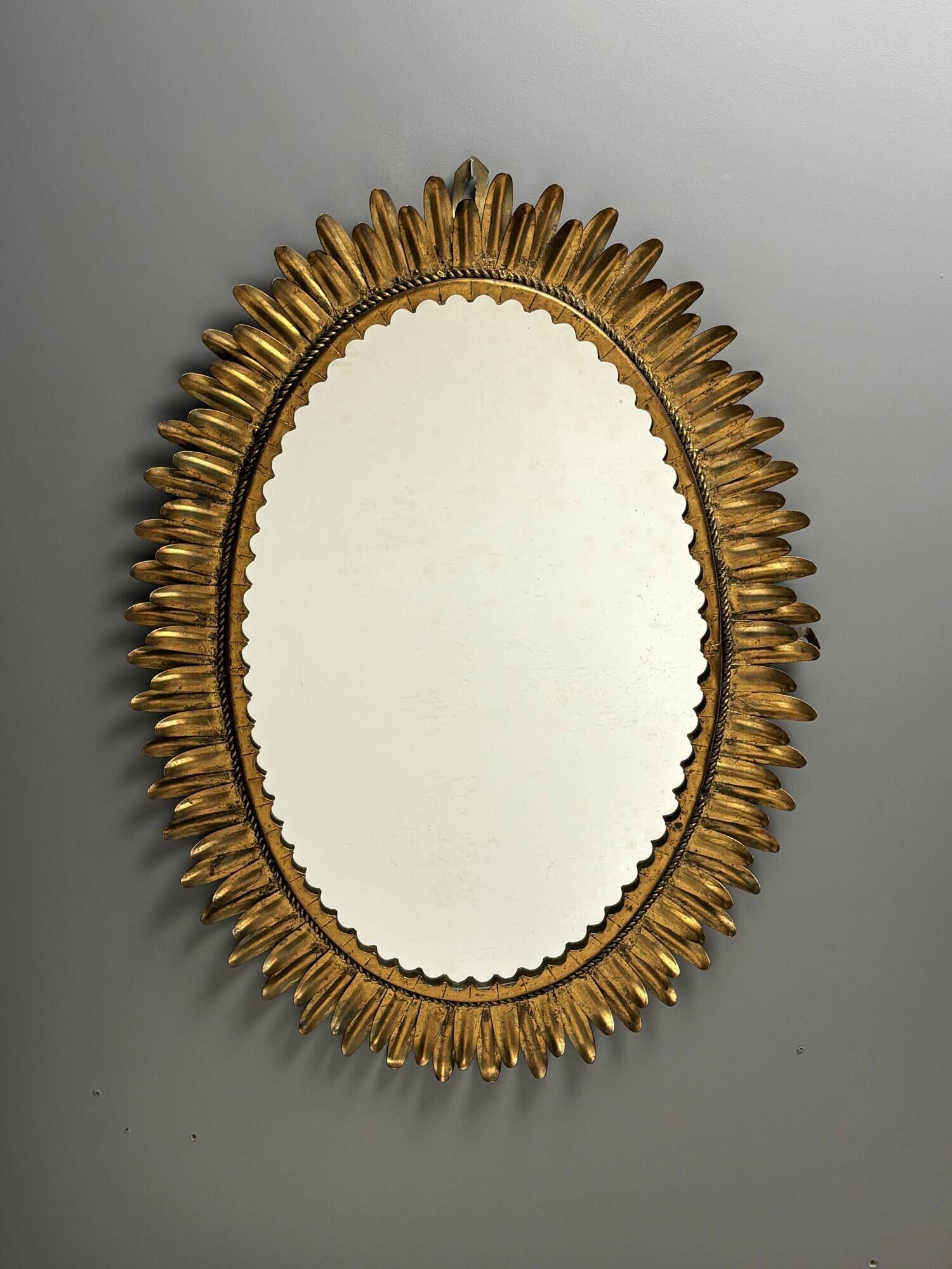 Midcentury bohemian Hollywood Regency Spanish gilt metal sun mirror, 1960s