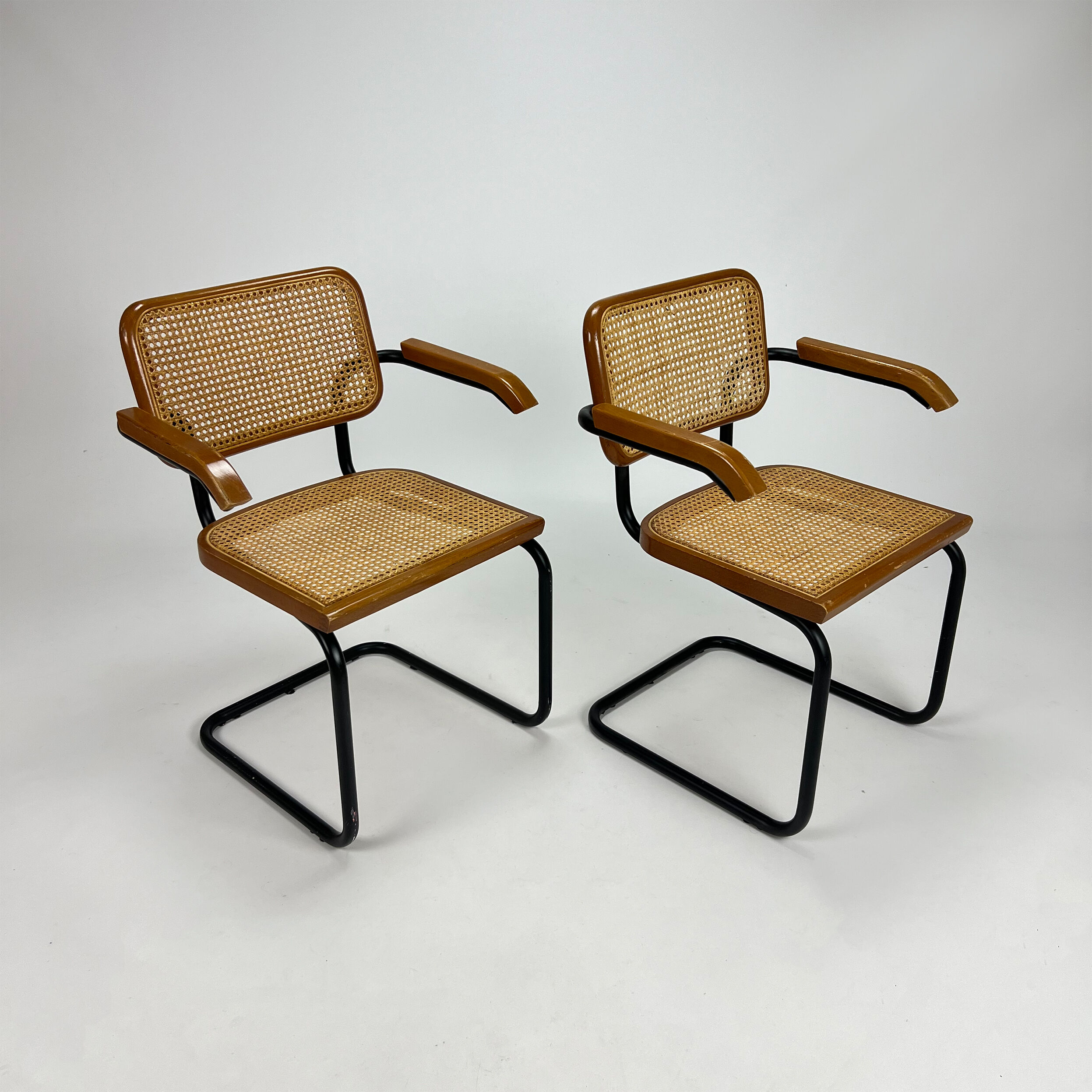 Set of 2 tubular black frame and cane cantilever dining chairs Breuer, italy, 1970s
