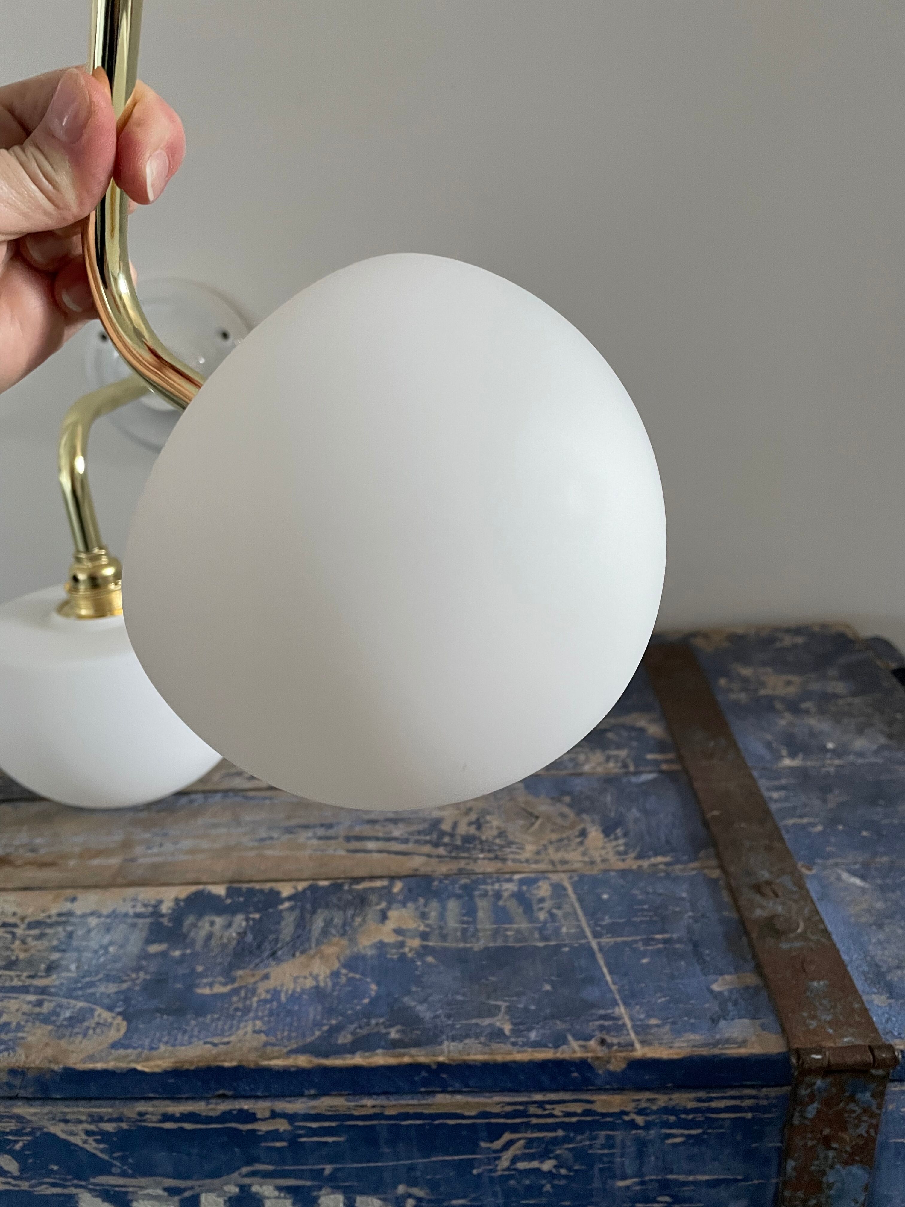 Set of two electrified white opaline wall lamps to nine