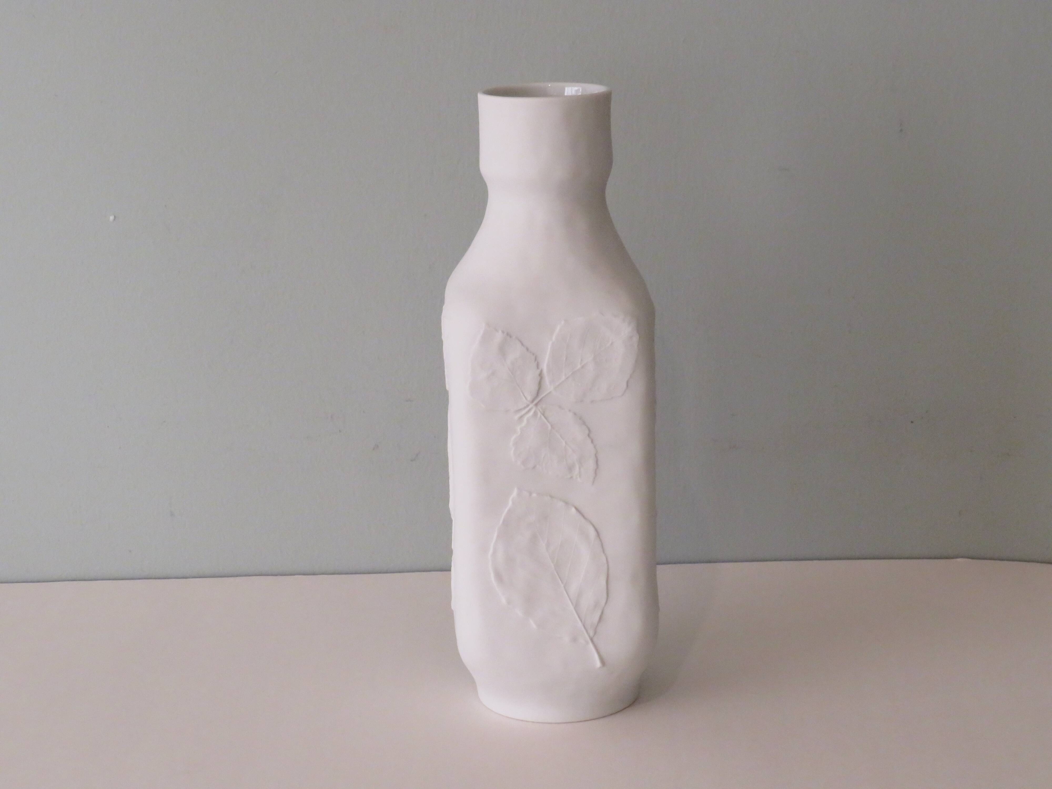 White biscuit vase with floral motif in relief, Hutschenreuther, Germany 1970
