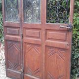 Porte d’entrée vitrée en chêne et grilles en fer, XIXème s.